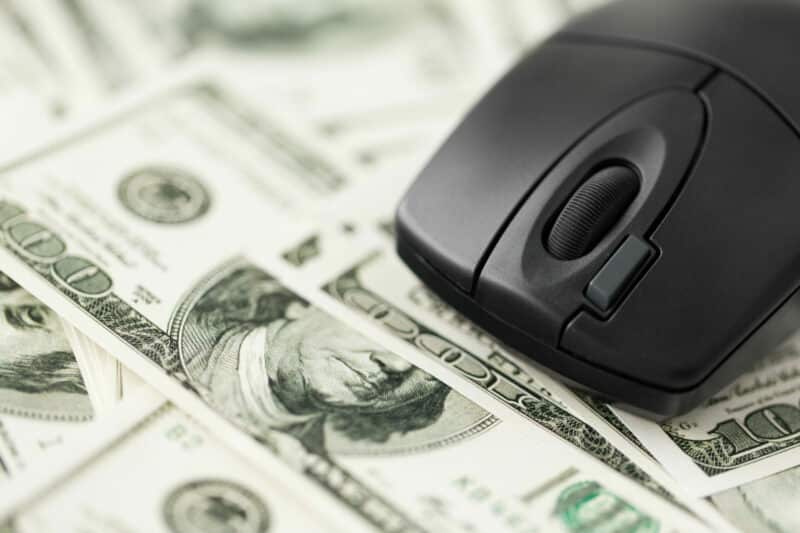 computer mouse on us dollar money